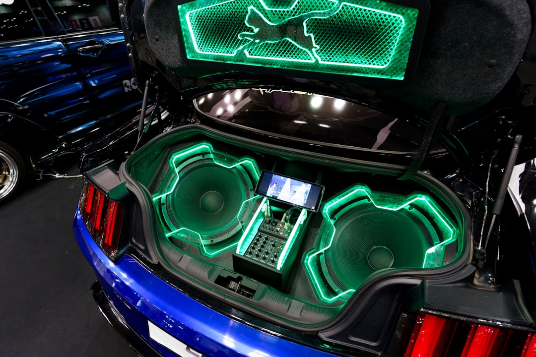 Premium car audio speakers and subwoofer installation showcasing sound quality components